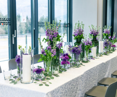 Purple and violet wedding flower arrangements, made out of carna
